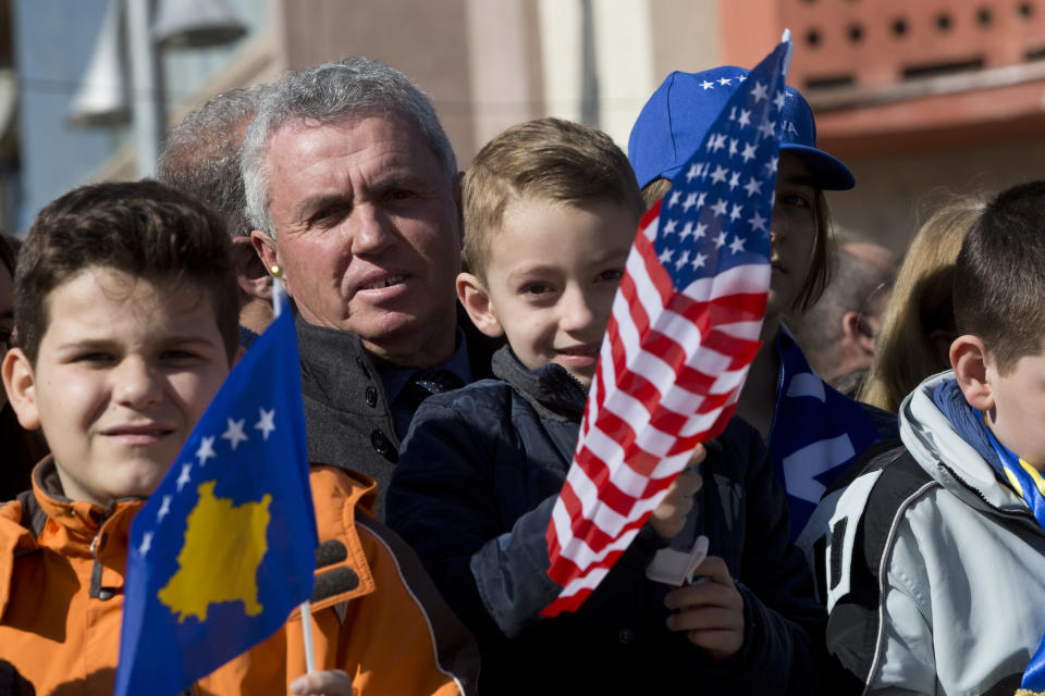 Kosovars waving national and U.S flags gather, during celebrations to mark the 11th anniversary of independence, in Pristina, Sunday, Feb. 17, 2019. Kosovo has celebrated its 11th anniversary of independence with a military a parade but still in tense relations with its former foe Serbia. (AP Photo/Visar Kryeziu)(AP Photo/Visar Kryeziu)