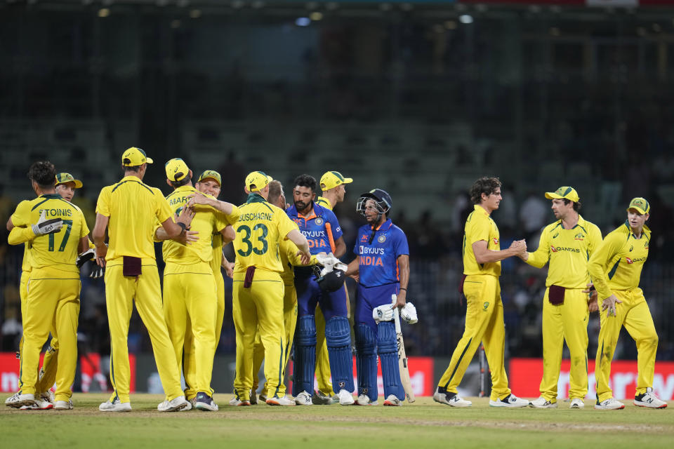 Indian batsmen, in blue, greet Australian players after Australia won the third and last one day international cricket match against India in Chennai, India, Wednesday, March 22, 2023. Australia won the series 2-1. (AP Photo/Aijaz Rahi)