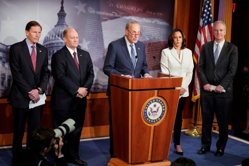 Senate Minority Leader Chuck Schumer speaks to journalists after the beginning of the Trump impeachment trial on Capitol Hill in Washington