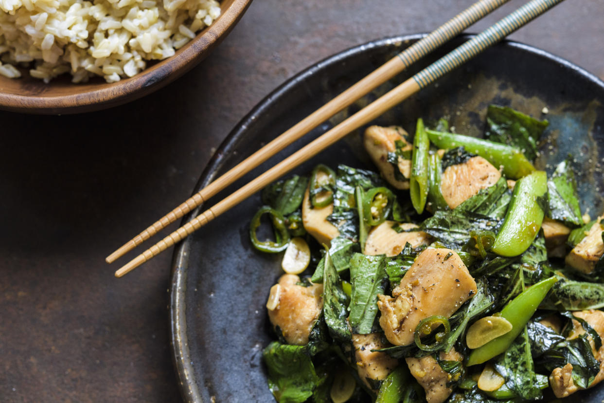 This image released by Milk Street shows a recipe for Stir-Fried Chicken w/Snap Peas & Basil. (Milk Street via AP)