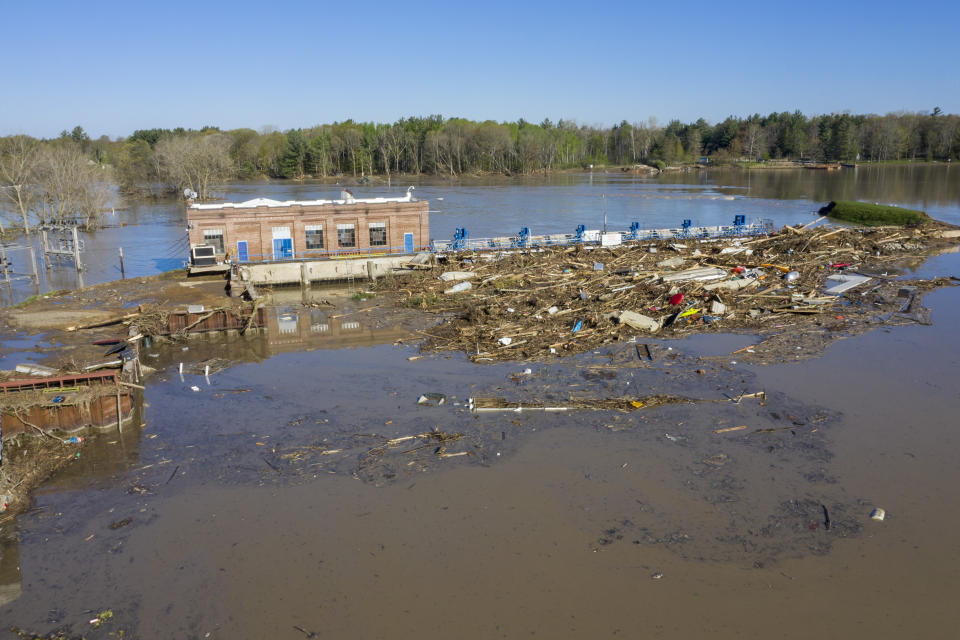 A look at the Sanford Dam on Wednesday, May 20, 2020. After the Edenville Dam failed and the Tittabawassee River flooded surrounding areas, many residents were urged to leave their homes and to brace themselves for the possibility of the Sanford Dam collapsing. Water flowed over the top of it through the night, but the structure is still in place. (Kaytie Boomer/The Bay City Times via AP)