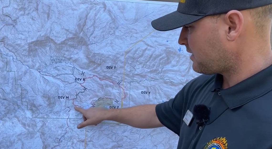 Matt Ahearn, deputy deputy operations chief with the California Interagency Incident Management Team overseeing the Washburn Fire in Yosemite National Park, points out where crews have made progress building lines to contain the wildfire near Wawona Road on Monday, July 11, 2022.