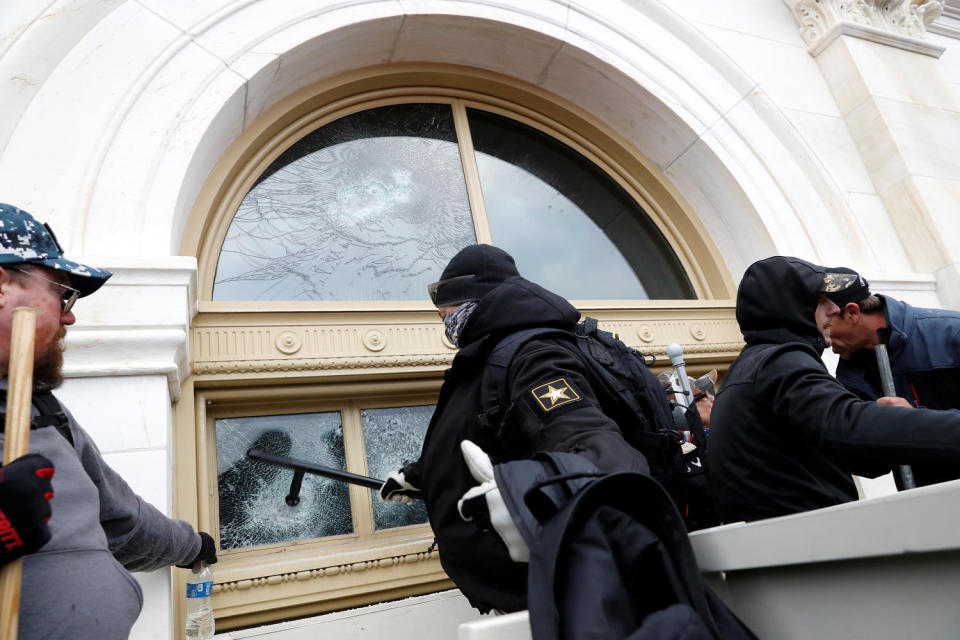 William Lewis, center, and Jonathan Joshua Munafo, right, at the U.S. Capitol Building (Shannon Stapleton / Reuters file )