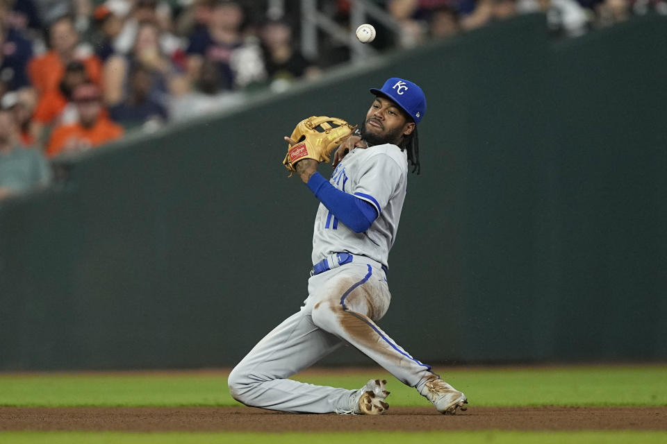 Kansas City Royals third baseman Maikel Garcia tries to field a single by Houston Astros' Jose Altuve during the seventh inning of a baseball game Friday, Sept. 22, 2023, in Houston. (AP Photo/David J. Phillip)