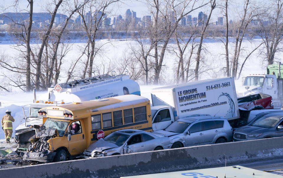 Emergency personnel gather at the scene following a multi-vehicle crash on the south shore of Montreal in La Prairie, Quebec, Wednesday, Feb. 19, 2020. (Paul Chiasson/The Canadian Press via AP)