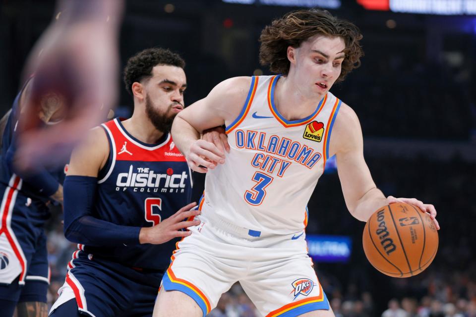 Thunder guard Josh Giddey (3) tries to get past Wizards guard Tyus Jones (5) on Friday night at Paycom Center.