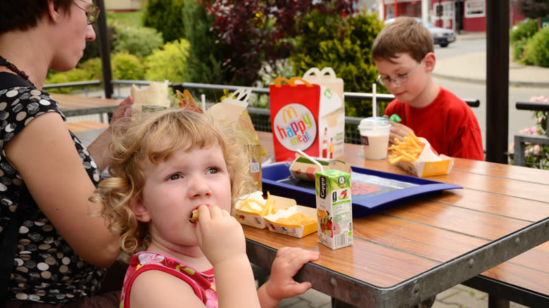 children eating happy meals