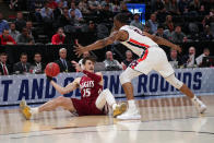 <p>Ivan Aurrecoechea #15 of the New Mexico State Aggies handles the ball during the first half against Horace Spencer #0 of the Auburn Tigers in the first round of the 2019 NCAA Men’s Basketball Tournament at Vivint Smart Home Arena on March 21, 2019 in Salt Lake City, Utah. (Photo by Tom Pennington/Getty Images) </p>