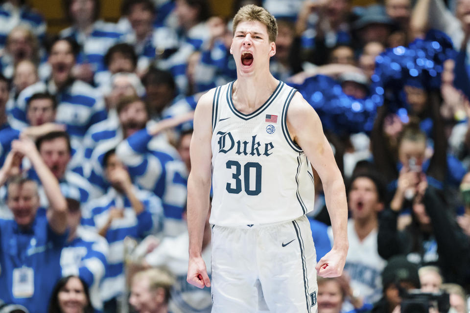 Duke center Kyle Filipowski reacts after a dunk in the first half of an NCAA college basketball game against Miami on Saturday, Jan. 21, 2023, in Durham, N.C. (AP Photo/Jacob Kupferman)