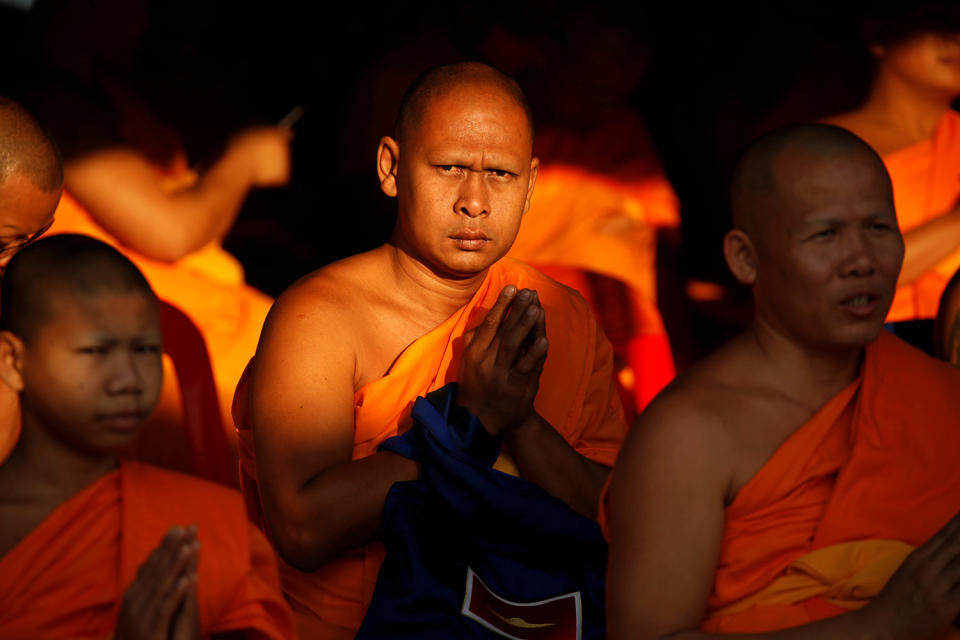 Buddhist monks chant inside Dhammakaya temple