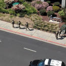 <p>Law enforcement officials react following a shooting at the headquarters of YouTube in San Bruno, Calif. on April 3, 2018. (Photo: Graeme Macdonald/Via Reuters) </p>