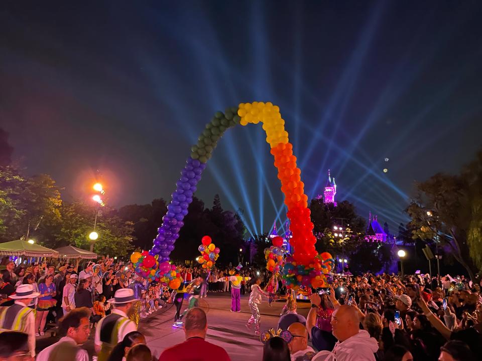 rainbow balloon arches in a parade