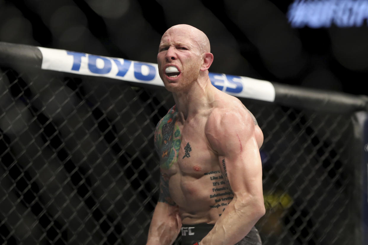 Josh Emmett celebrates his KO against Michael Johnson after their mixed martial arts bout at UFC Fight Night, Saturday, March 30, 2019, in Philadelphia. Emmett won via 3rd round KO. (AP Photo/Gregory Payan)