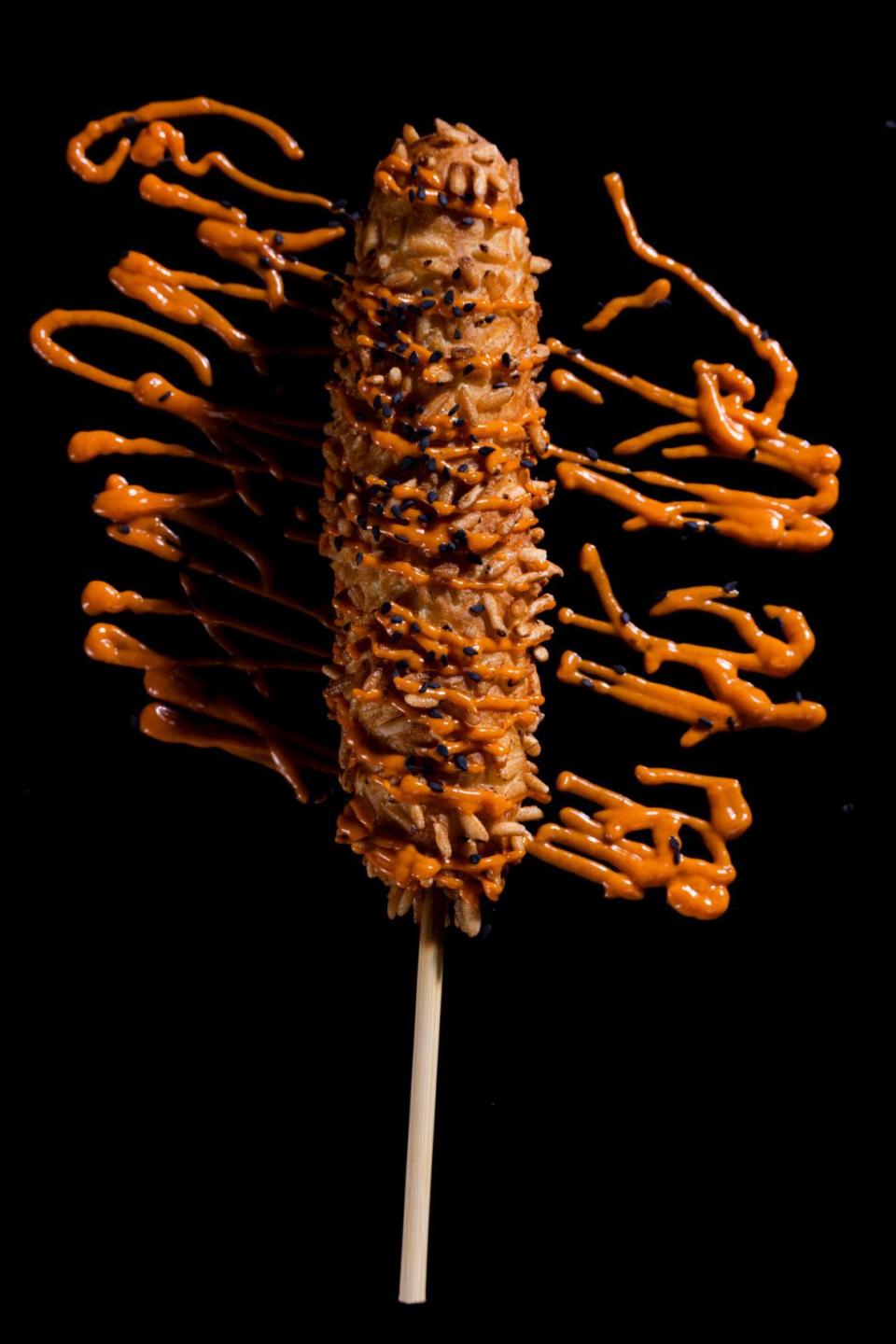 •	Maggot Covered Cheese Dog (inspired by “Bugs: Eaten Alive” original haunted house): A Korean-style hot dog with fresh mozzarella, rolled in puffed rice, topped with gochujang drizzle and black sesame seeds