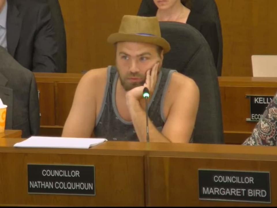 Sarnia Coun. Nathan Colquhoun wore a fedora and tank top on June 27 during debate of a motion calling for the adoption of a 'professional business attire' policy for council meetings. (Sarnia city council - image credit)