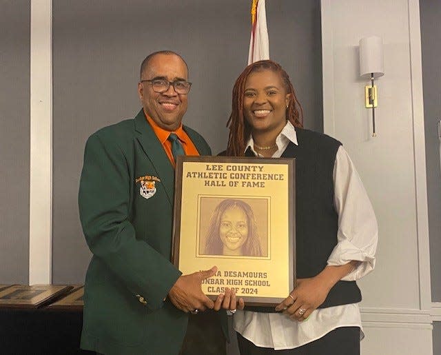 Former Dunbar High School basketball standout Kiara Desamours was among eight members of the Lee County Athletic Conference Hall of Fame's Class of 2024. With her is Dunbar principal Carl Burnside.