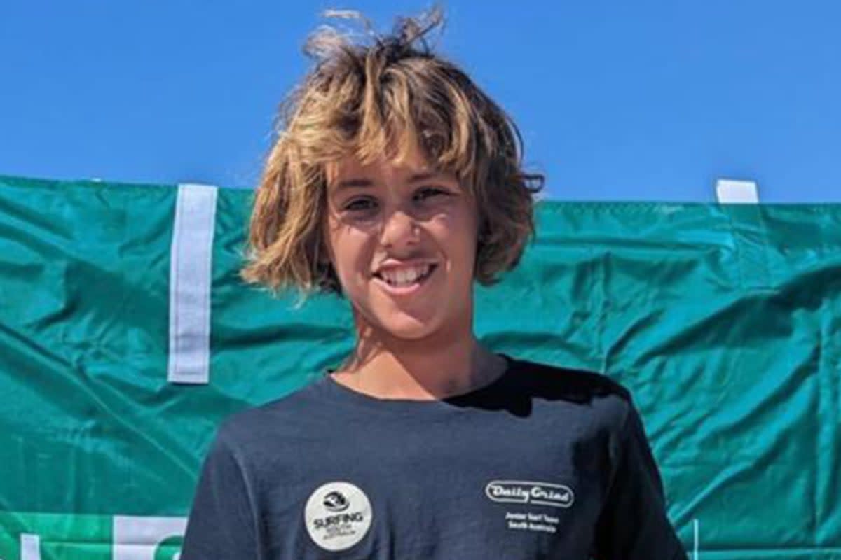 Hundreds of mourners have gathered at the favourite beach of a 15-year-old surfer who was killed in a horror shark attack (Supplied)