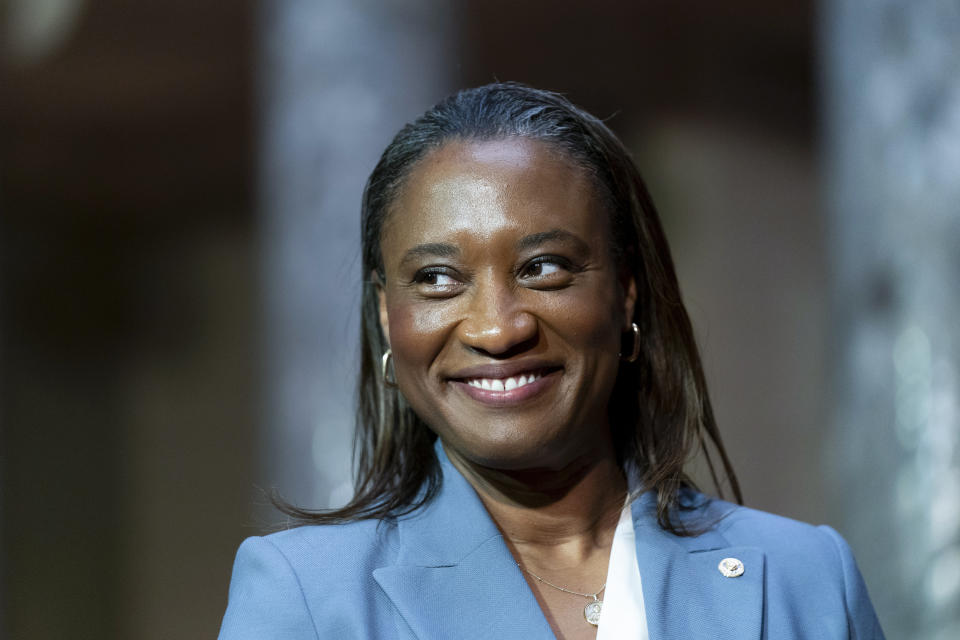 FILE - Laphonza Butler, D-Calif., smiles during a re-enactment of her swearing-in ceremony to the Senate to succeed the late Sen. Dianne Feinstein, Oct. 3, 2023, on Capitol Hill in Washington. Butler made history as the first Black and openly lesbian senator in Congress, when California Gov. Gavin Newsom appointed her. (AP Photo/Stephanie Scarbrough, File)