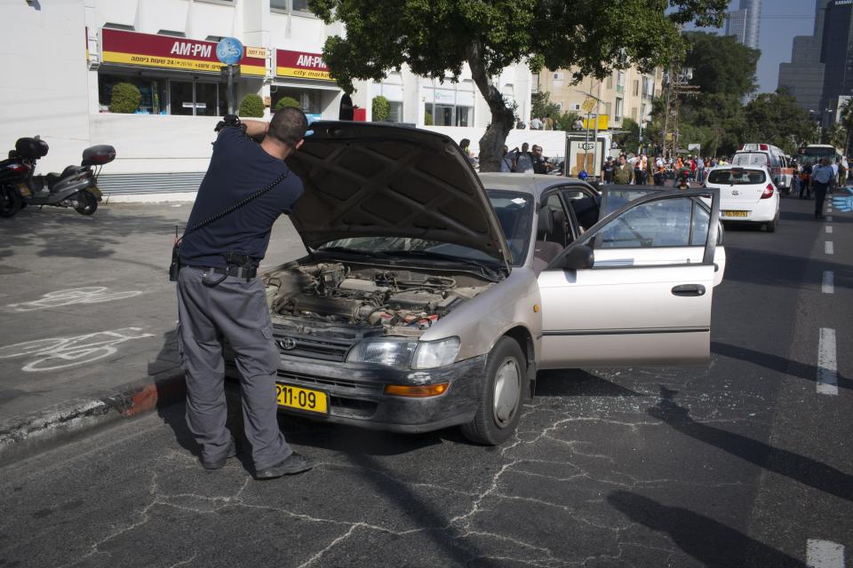 TEL AVIV, ISRAEL- NOVEMBER 21: A general view of the scene after an explosion on a bus with passengers onboard on November 21, 2012 in central Tel Aviv, Israel. At least ten people have been injured in a blast on a bus near military headquarters in what is being described as terrorist attack which threatens to derail ongoing cease-fire negotiations between Israeli and Palestinian authorities. (Photo by Ziv Oren/Getty Images)