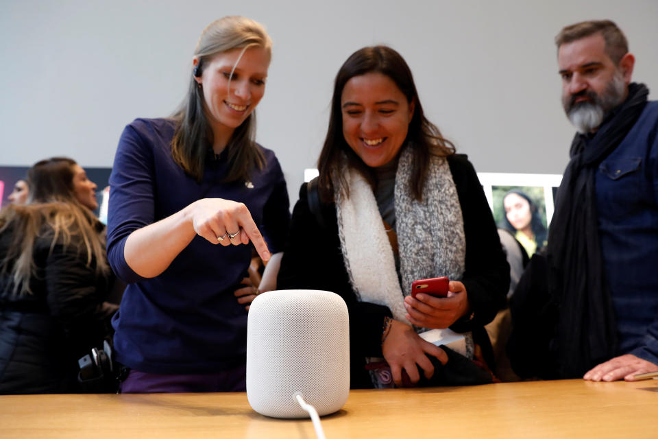 An Apple Store staff member demonstrates how the Apple HomePod, home sound system, works at the Apple store in Manhattan, New York, U.S., February 9, 2018. REUTERS/Shannon Stapleton