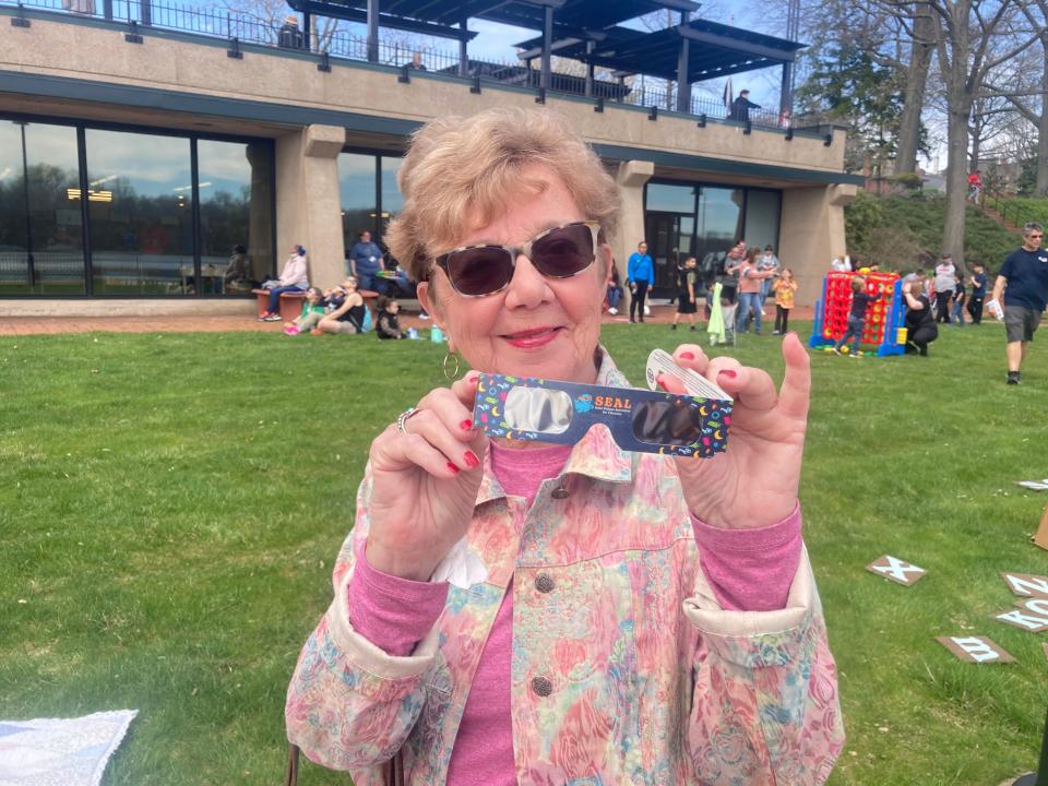 Andrea Mihaly, of Bristol, shows her solar eclipse glasses at the Grundy library on April 8, 2024. It’s her 81st birthday, too.