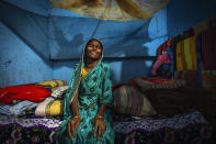 Ashiya cries after her son Siddique Ali, 23, was picked up by the police in Guwahati, India, Saturday, Feb. 4, 2023. Indian police have arrested more than 2,000 men in a crackdown on illegal child marriages in involving girls under the age of 18 a northeastern state. Ali is married to for Sonali Begum, 17, who is seven months pregnant. (AP Photo/Anupam Nath)