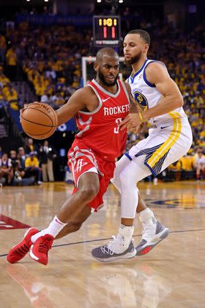 May 20, 2018; Oakland, CA, USA; Houston Rockets guard Chris Paul (3) drives to the basket against Golden State Warriors guard Stephen Curry (30) during the second quarter in game three of the Western conference finals of the 2018 NBA Playoffs at Oracle Arena. Mandatory Credit: Kyle Terada-USA TODAY Sports