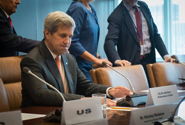 United States Secretary of State John Kerry, center attends a meeting with Middle East principals at the United Nations on September 23, 2016 in New York