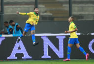 Brazil's Neymar, left, celebrates scoring his side's 4th goal against Peru during a qualifying soccer match for the FIFA World Cup Qatar 2022 at the National Stadium, in Lima, Peru, Tuesday, Oct.13, 2020. (Daniel Apuy, Pool via AP)