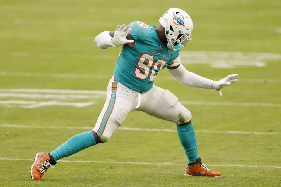 MIAMI GARDENS, FLORIDA - DECEMBER 06: Shaq Lawson #90 of the Miami Dolphins celebrates after a sack against the Cincinnati Bengals at Hard Rock Stadium on December 06, 2020 in Miami Gardens, Florida. (Photo by Michael Reaves/Getty Images)