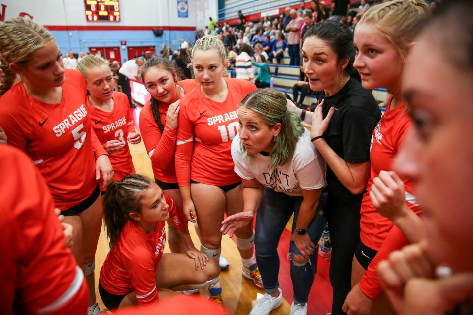 Sprague head coach Anne Olsen huddles with the team during the match against South Salem on Thursday, Sept. 15, 2022 at South Salem High School in Salem, Ore.