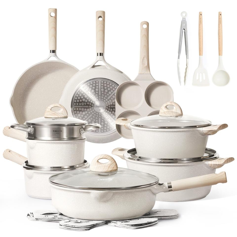 Cookware set featuring pots, pans, utensils, and lids