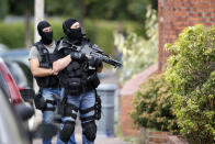 <p>Members of French special police forces of Research and Intervention Brigade (BRI) are seen during a raid after a hostage-taking in the church in Saint-Etienne-du-Rouvray near Rouen in Normandy, France, July 26, 2016. (REUTERS/Pascal Rossignol)</p>