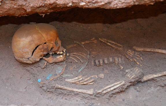 People were buried beside the pyramids in tomb chambers that often held more than one individual. This image shows a child who was buried with necklaces. (Vincent Francigny/SEDAU) <br> <br> <a href="http://www.livescience.com/26900-ancient-pyramids-sudan.html" rel="nofollow noopener" target="_blank" data-ylk="slk:Click here for the full story at LiveScience.com;elm:context_link;itc:0;sec:content-canvas" class="link ">Click here for the full story at LiveScience.com</a>