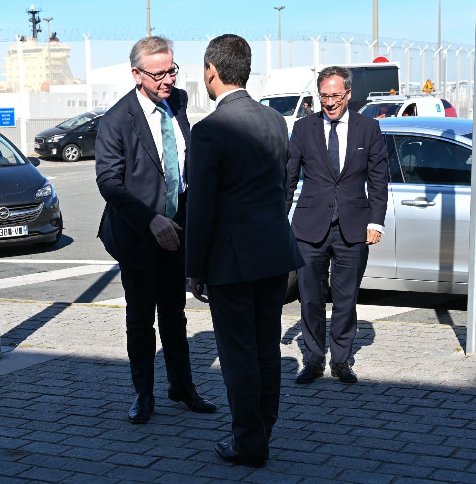 French Minister of Public Action and Accounts Gerald Darmanin (C) shakes hands with Britain's Chancellor of the Duchy of Lancaster Michael Gove (L) in the northern French port of Calais on August 30, 2019. (Photo by DENIS CHARLET / AFP)        (Photo credit should read DENIS CHARLET/AFP/Getty Images)