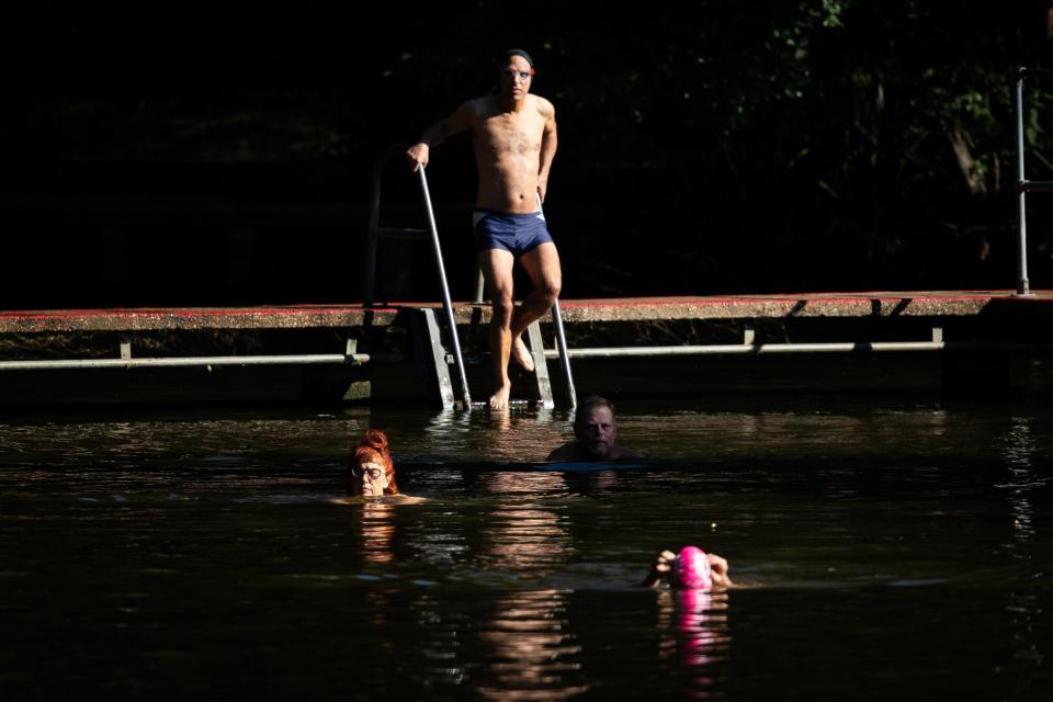 Swimmers at one of the Hampstead Heath ponds (PA)