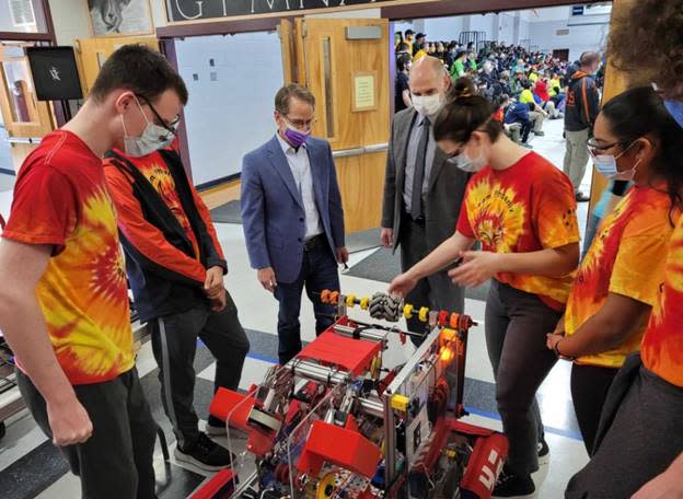 Frank Edelblut, commissioner of education, and Mark Rubinstein, chancellor of the Community College System of New Hampshire, join Team Phoenix from the Academy for Science and Design at the 2021 Governor’s Cup hosted last year by Battle of the Bay at Prospect Mountain High School.