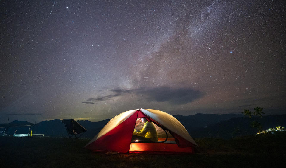 Camping in a Tent Under the Stars and Milky Way Galaxy (Seksan Mongkhonkhamsao / Getty Images)