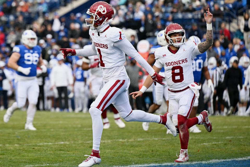 Oklahoma Sooners wide receiver Jayden Gibson (1) and quarterback <a class="link " href="https://sports.yahoo.com/ncaaf/players/299857" data-i13n="sec:content-canvas;subsec:anchor_text;elm:context_link" data-ylk="slk:Dillon Gabriel;sec:content-canvas;subsec:anchor_text;elm:context_link;itc:0">Dillon Gabriel</a> (8) celebrate after a touchdown as BYU and Oklahoma play at LaVell Edwards Stadium in Provo on Saturday, Nov. 18, 2023. | Scott G Winterton, Deseret News