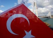 Newly built Yavuz Sultan Selim bridge, the third bridge over the Bosphorus linking the city's European and Asian sides is pictured with a Turkish flag during the opening ceremony in Istanbul, Turkey, August 26, 2016. REUTERS/Murad Sezer