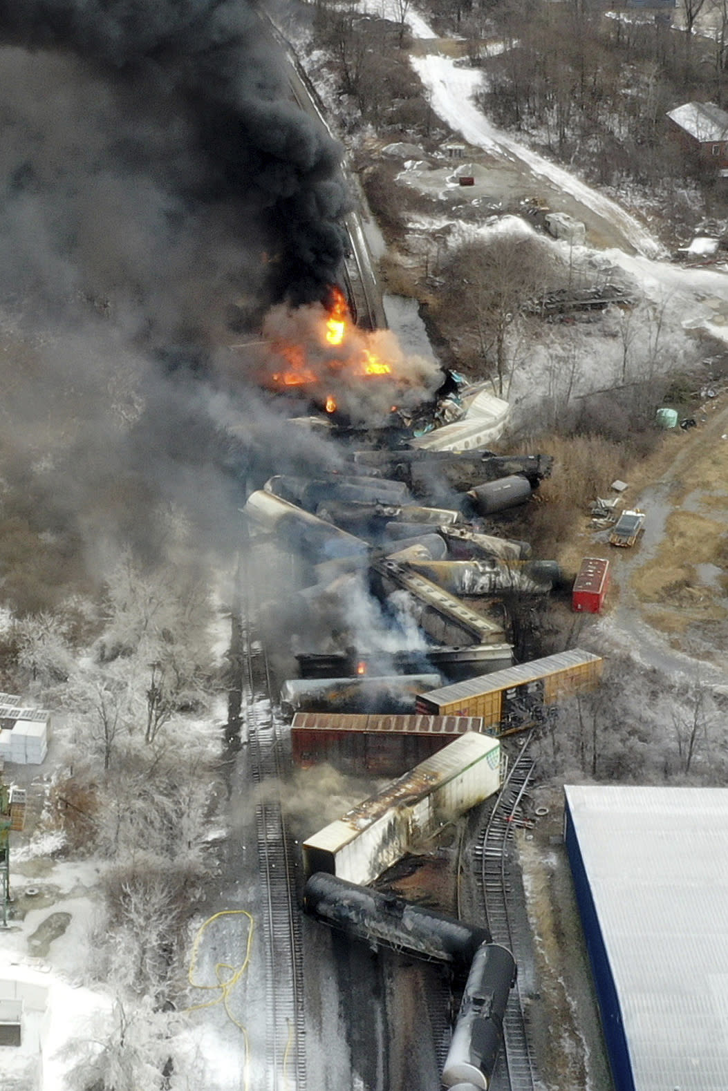 This photo taken with a drone shows portions of a Norfolk and Southern freight train that derailed Friday night in East Palestine, Ohio are still on fire at mid-day Saturday, Feb. 4, 2023. (AP Photo/Gene J. Puskar)