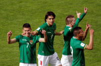 Football Soccer - Bolivia v Argentina - World Cup 2018 Qualifiers - Hernando Siles stadium, La Paz, Bolivia 28/3/17. Bolivia's Juan Carlos Arce (L) celebrates with Marcelo Martins (2nd L) and other teammates after he scored a goal. REUTERS/Manuel Claure