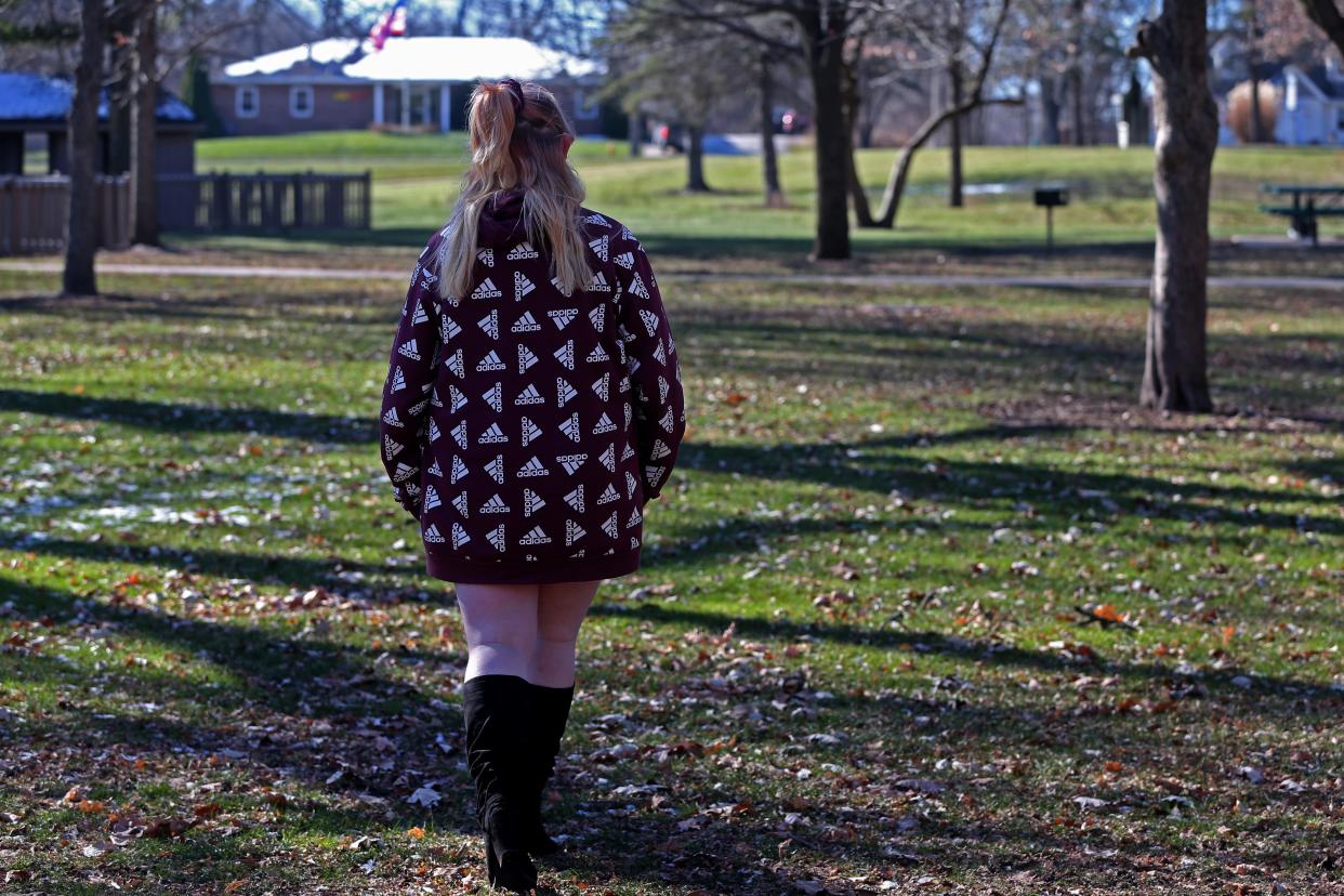 A youth named Dezy walks at a park in Janesville in 2022. Dezy is unaccompanied and homeless.