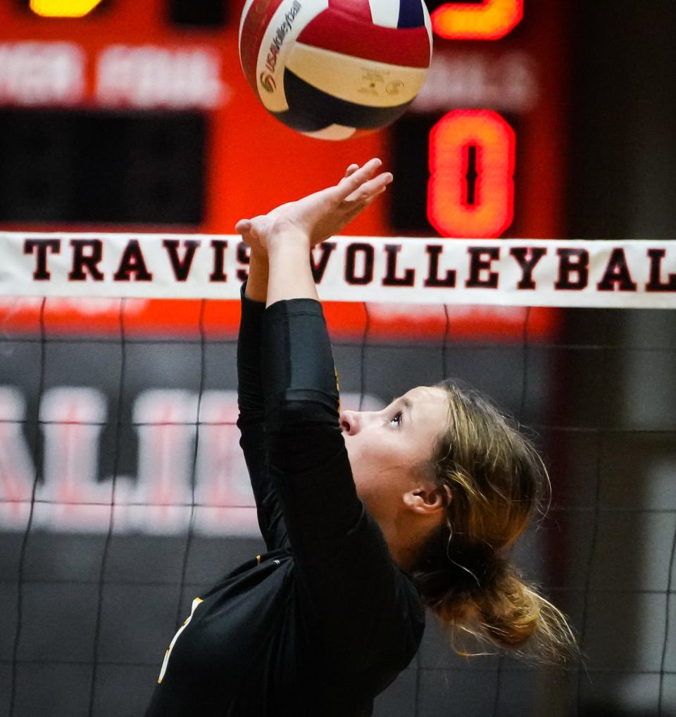Dripping Springs setter Presley Alford sets up a shot for a teammate during Tuesday night's District 26-6A showdown at Lake Travis. The Cavaliers won in four sets.