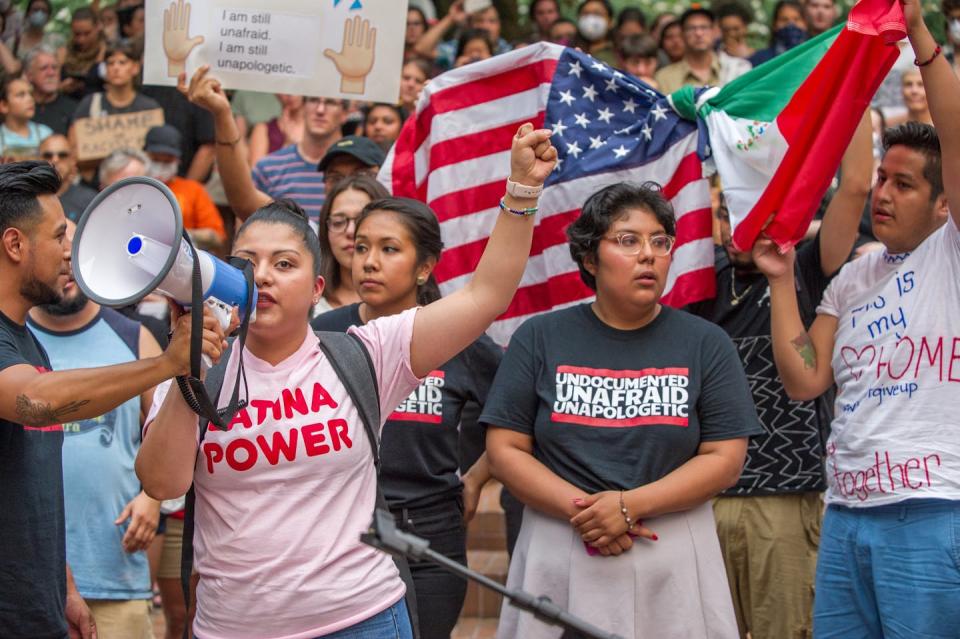 At a 2017 rally, one activist wears a T-shirt reading ‘Undocumented and Unafraid.’ <a href="https://www.shutterstock.com/image-photo/activists-wearing-tshirt-reading-undocumented-unafraid-772202494" rel="nofollow noopener" target="_blank" data-ylk="slk:Diego G Diaz/Shutterstock.com;elm:context_link;itc:0;sec:content-canvas" class="link ">Diego G Diaz/Shutterstock.com</a>