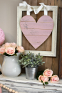 <p>A framed heart made of shiplap and vases of faux flowers serve as the focal point for this beautiful Valentine's Day mantel display.</p><p><strong>Get the tutorial at <a href="http://awonderfulthought.com/pretty-pink-gray-valentines-day-mantel/" rel="nofollow noopener" target="_blank" data-ylk="slk:A Wonderful Thought;elm:context_link;itc:0;sec:content-canvas" class="link ">A Wonderful Thought</a>.</strong></p><p><strong><a class="link " href="https://www.amazon.com/slp/wood-heart-wall-decor/uv2r7uzb6zwxo92?tag=syn-yahoo-20&ascsubtag=%5Bartid%7C10050.g.2971%5Bsrc%7Cyahoo-us" rel="nofollow noopener" target="_blank" data-ylk="slk:SHOP HEART DECOR;elm:context_link;itc:0;sec:content-canvas">SHOP HEART DECOR</a><br></strong></p>