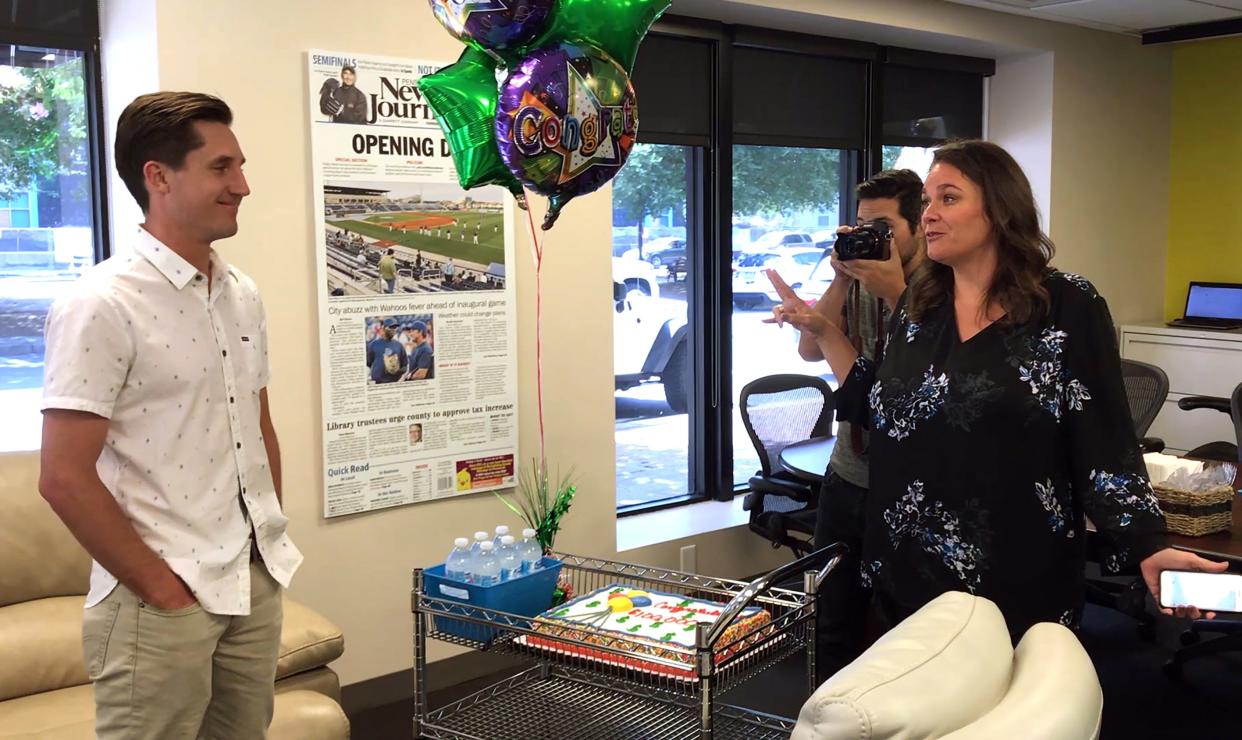 Pensacola News Journal Executive Editor Lisa Nellessen Savage, right, helps to deliver the news to Jon Shell and his organization, Upward Intuition, was named a recipient of a $100,000 grant from Gannett, on Tuesday June, 19, 2018. Shell and his organization are planning to build a skatepark in downtown Pensacola.