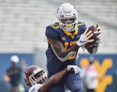 West Virginia wide receiver Sam James (13) catches a pass for a touchdown against Eastern Kentucky during an NCAA college football game on Saturday, Sept. 12, 2020, in Morgantown, W.Va. (William Wotring/The Dominion-Post via AP)