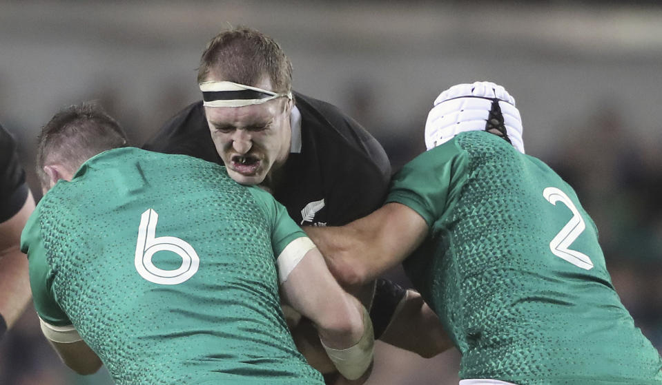 New Zealand's Sam Whitelock is tackled by Ireland's Peter O'Mahony, left, and Rory Best during the rugby union international match between Ireland and the New Zealand All Blacks at the Aviva Stadium, Dublin, Ireland, Saturday Nov. 17, 2018. (Niall Carson, PA via AP)
