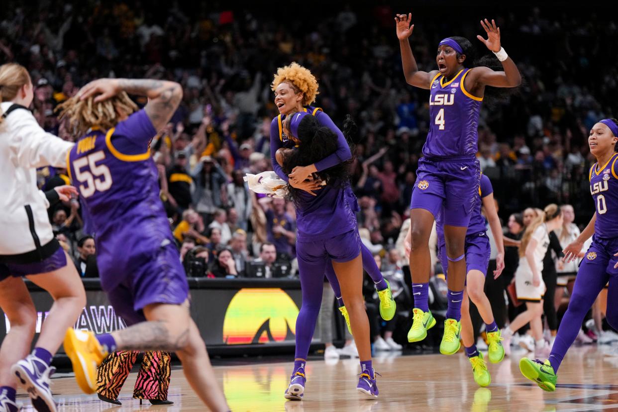 LSU players celebrate after beating Iowa to win the NCAA women's basketball national title.